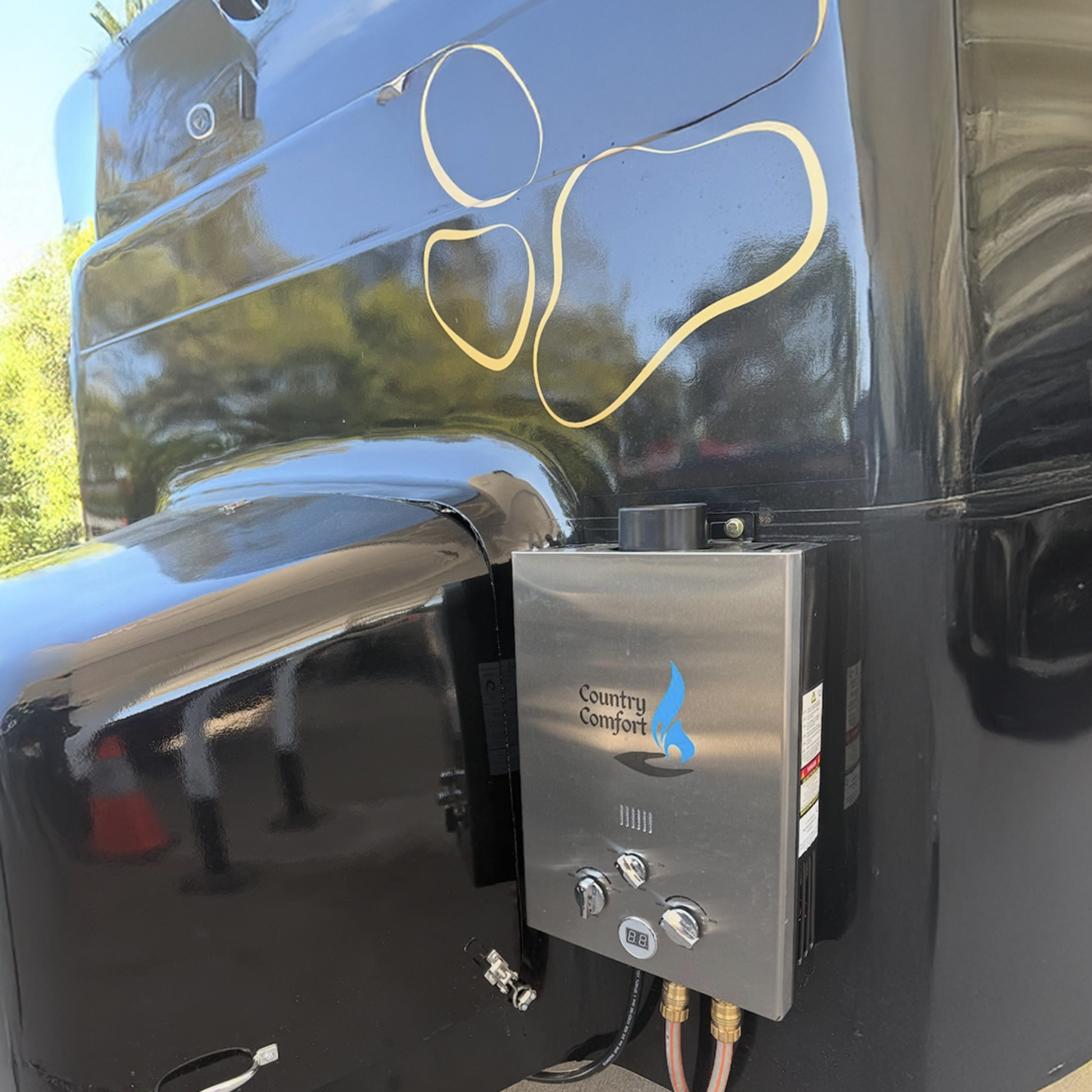 Metallic vehicle with 'Country Comfort' logo on a black background